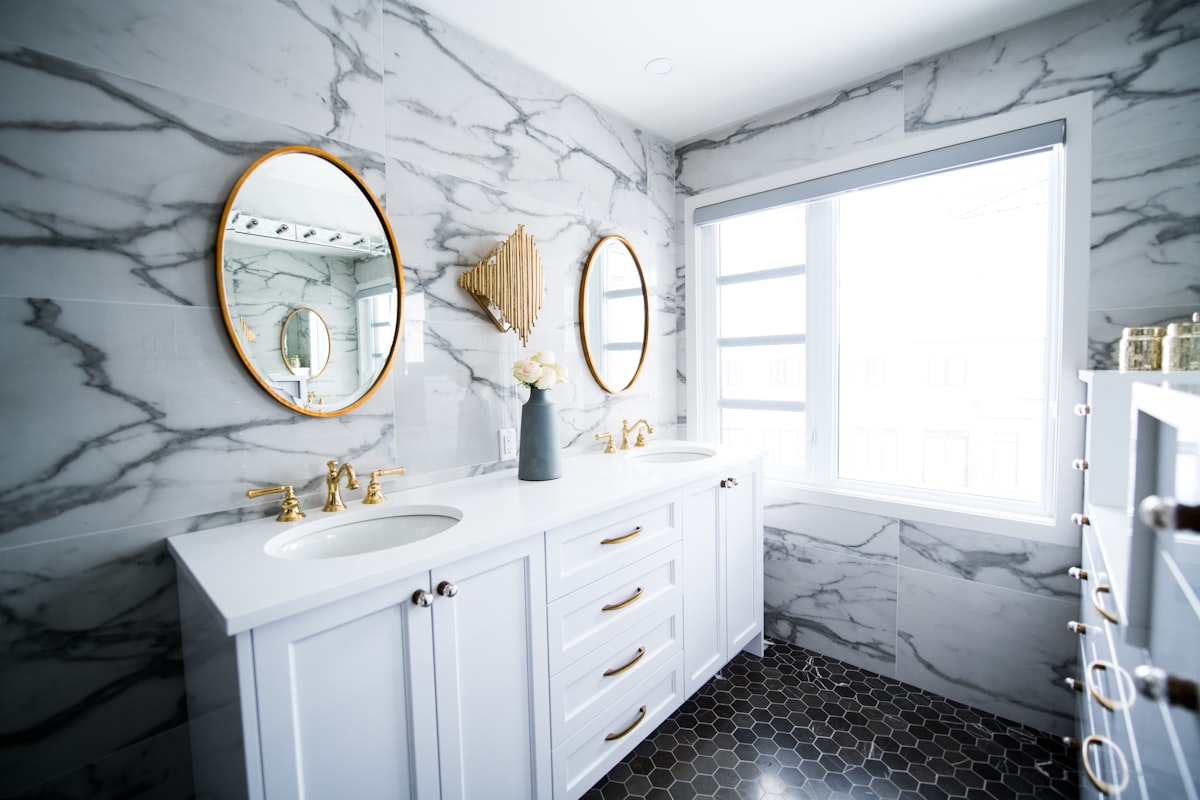 Double-Sink Marble Vanity with Brass Fixtures