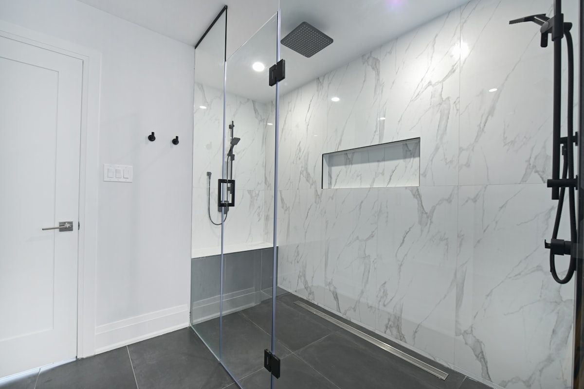 Frameless Glass Walk-In Shower with Marble Tile
