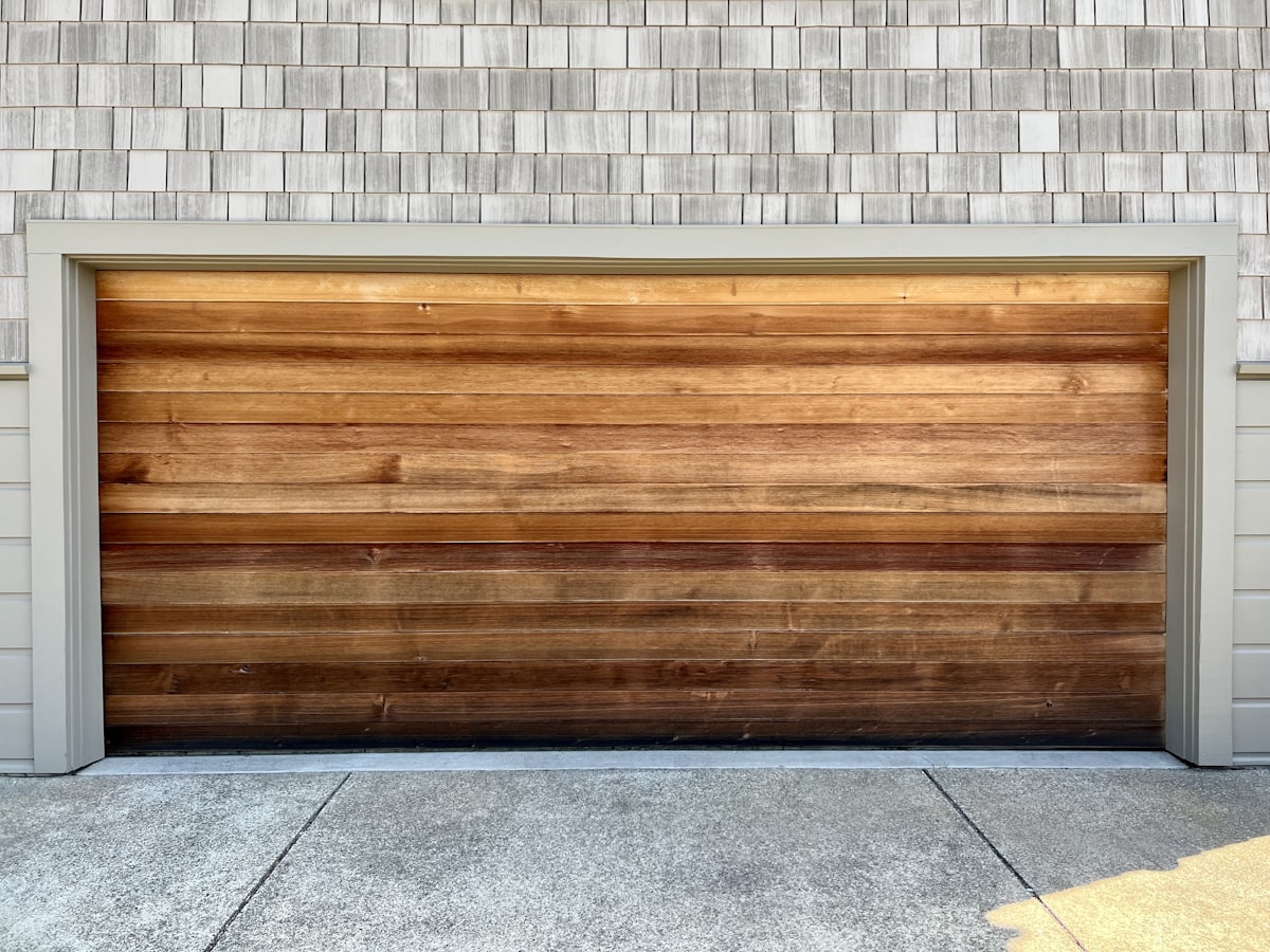 Flush Horizontal Wood-Slat Garage Door in Graduated Stain Tones