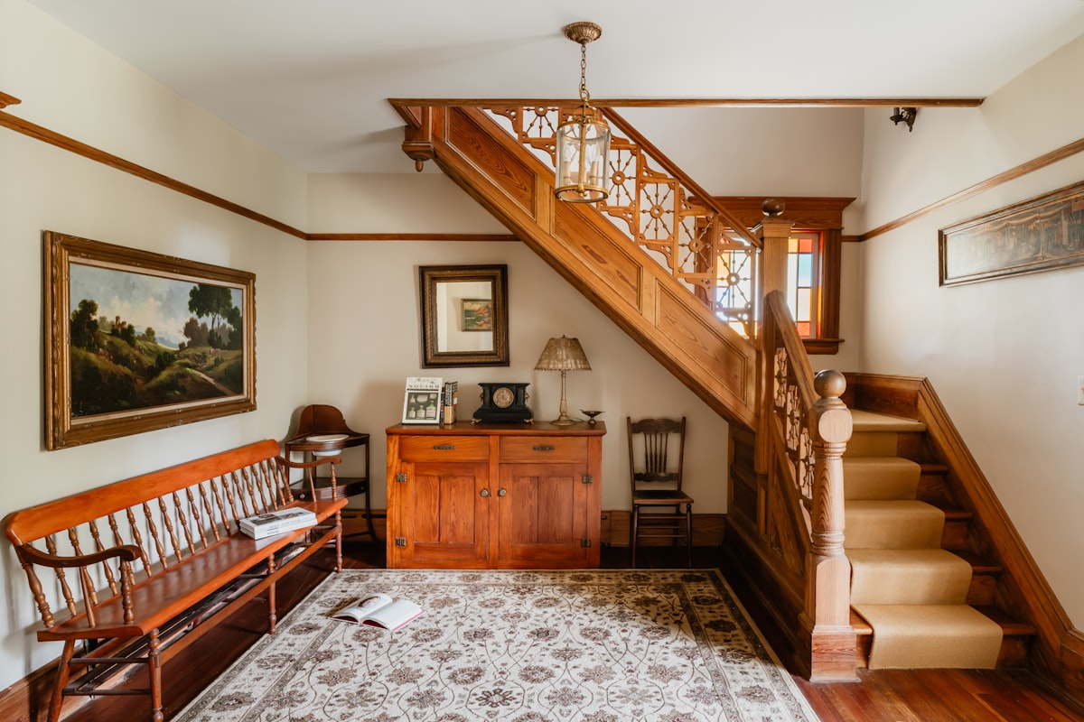 New Beige Stair Runner with Exposed Wood Tread Margins and Original Banister