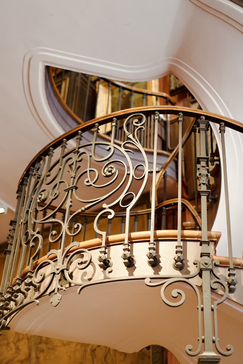 Ornate Wrought-Iron Stair Railing on a Curved Staircase