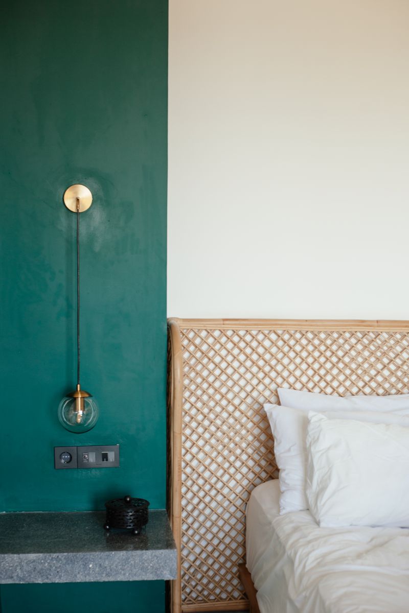 Bold Green Accent Wall Beside a Bed